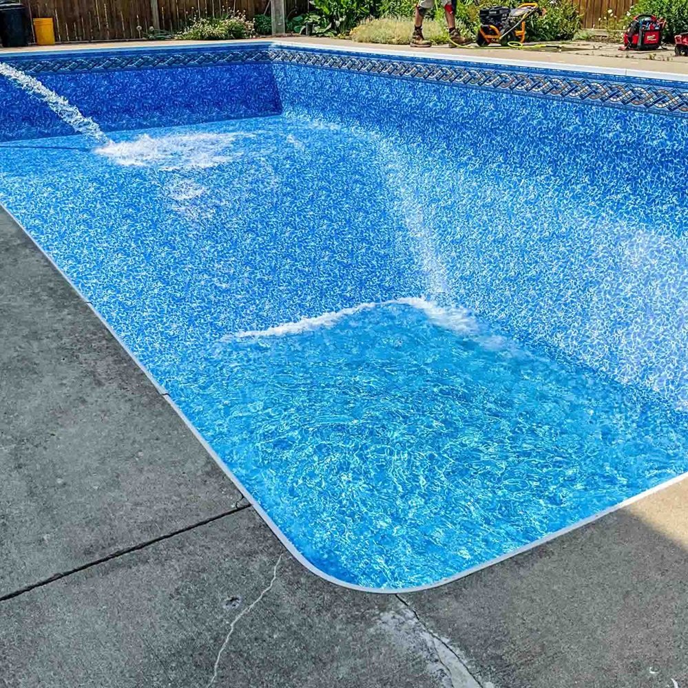 Mawby's Pools team expertly fitting a premium pool liner in a Cleveland South Euclid home, enhancing its beauty and longevity