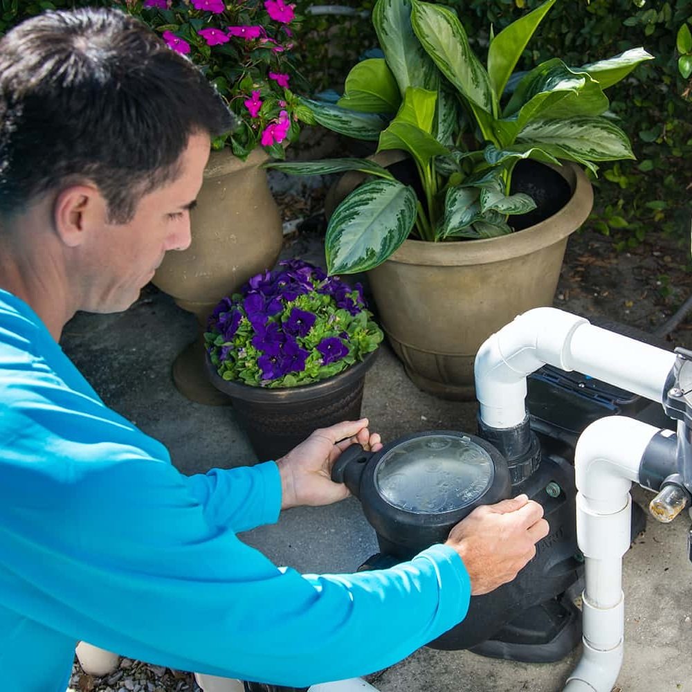 Skilled technician from Mawby's Pools diagnosing pool equipment issues in Cleveland South Euclid, showcasing expertise and dedication